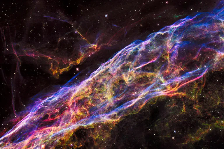 Stars and gas clouds set against a dark background.
