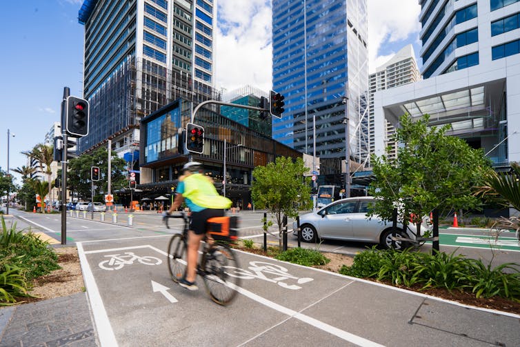 Person on bike using bike lanes in city