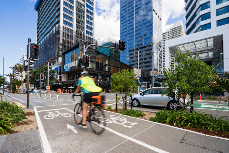 Person on bike using bike lanes in city