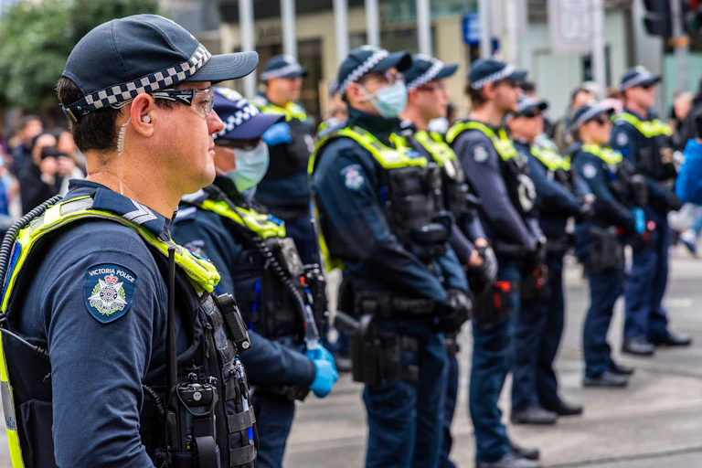 A row of police officers lined up in the street in Australia