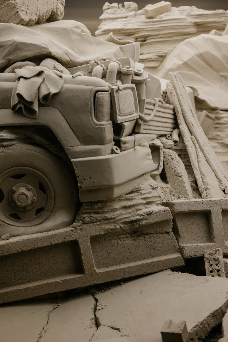 Close up: the front of a crushed in ute.