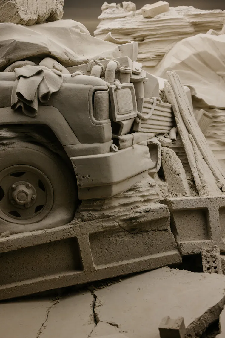 Close up: the front of a crushed in ute.