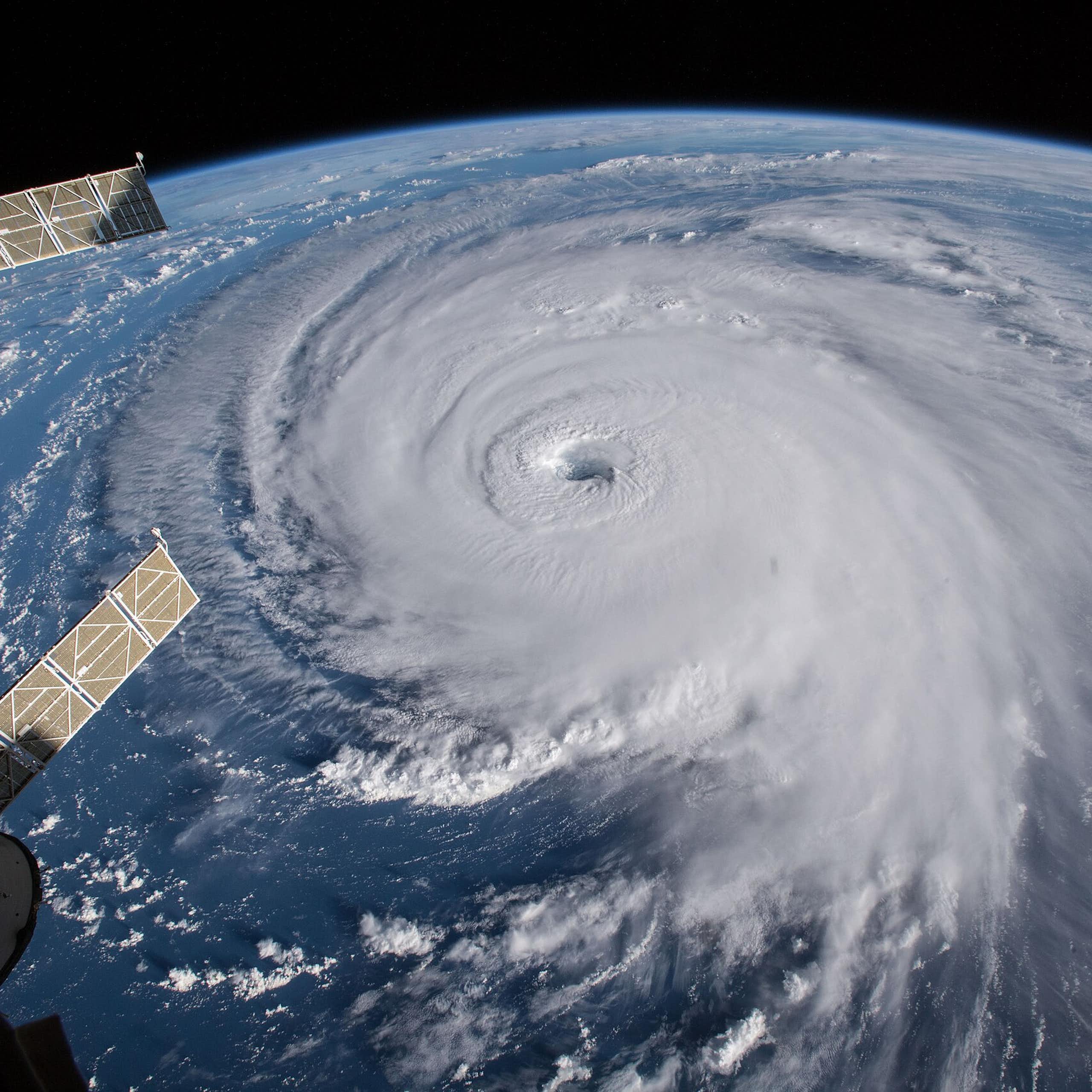 A hurricane seen from space. Parts of the space station are visible in the image.