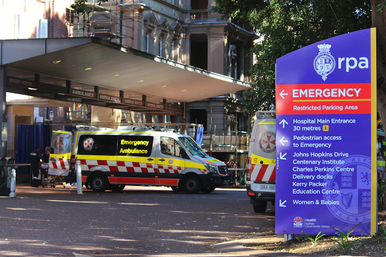 Ambulance unloads patient to an emergency department