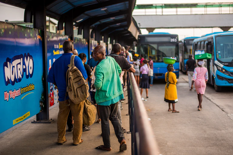People at a bus stop