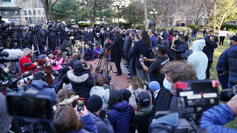 Media cover an event.