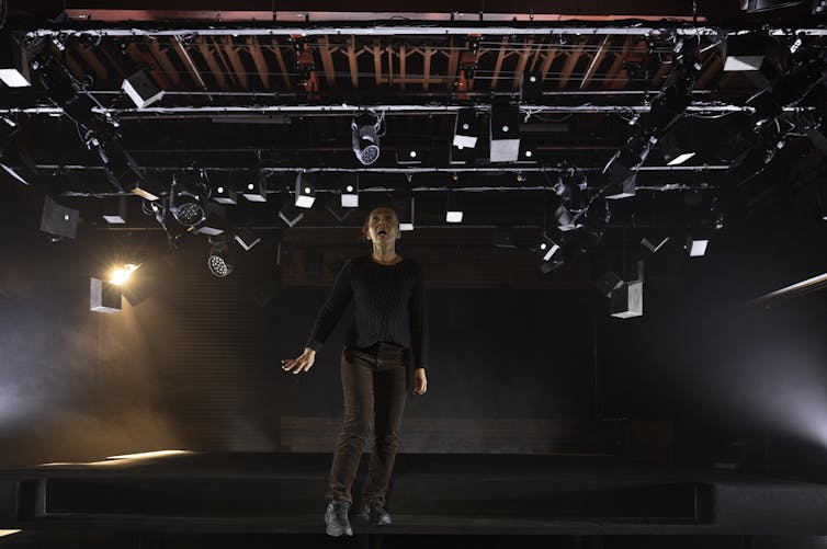 Arundell stands centre stage.