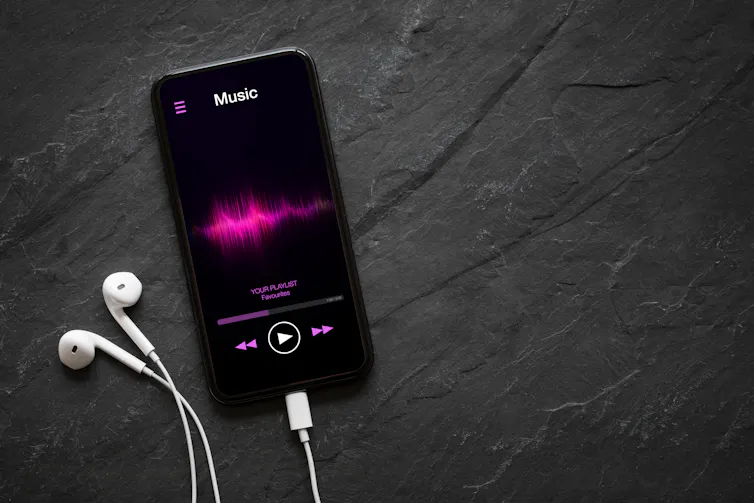 Mobile phone displaying a music streaming app.