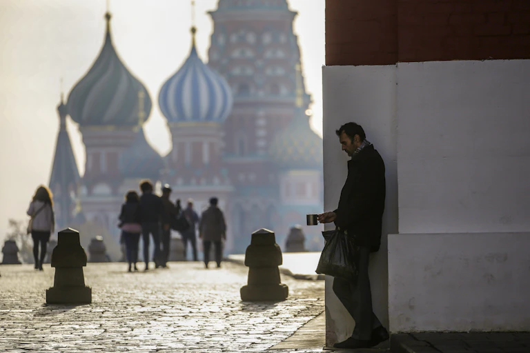 Man begging for money in Red Square.