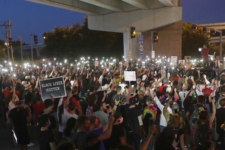 A group of protesters gather.