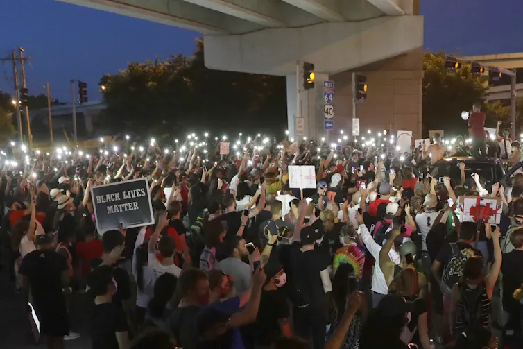 A group of protesters gather.