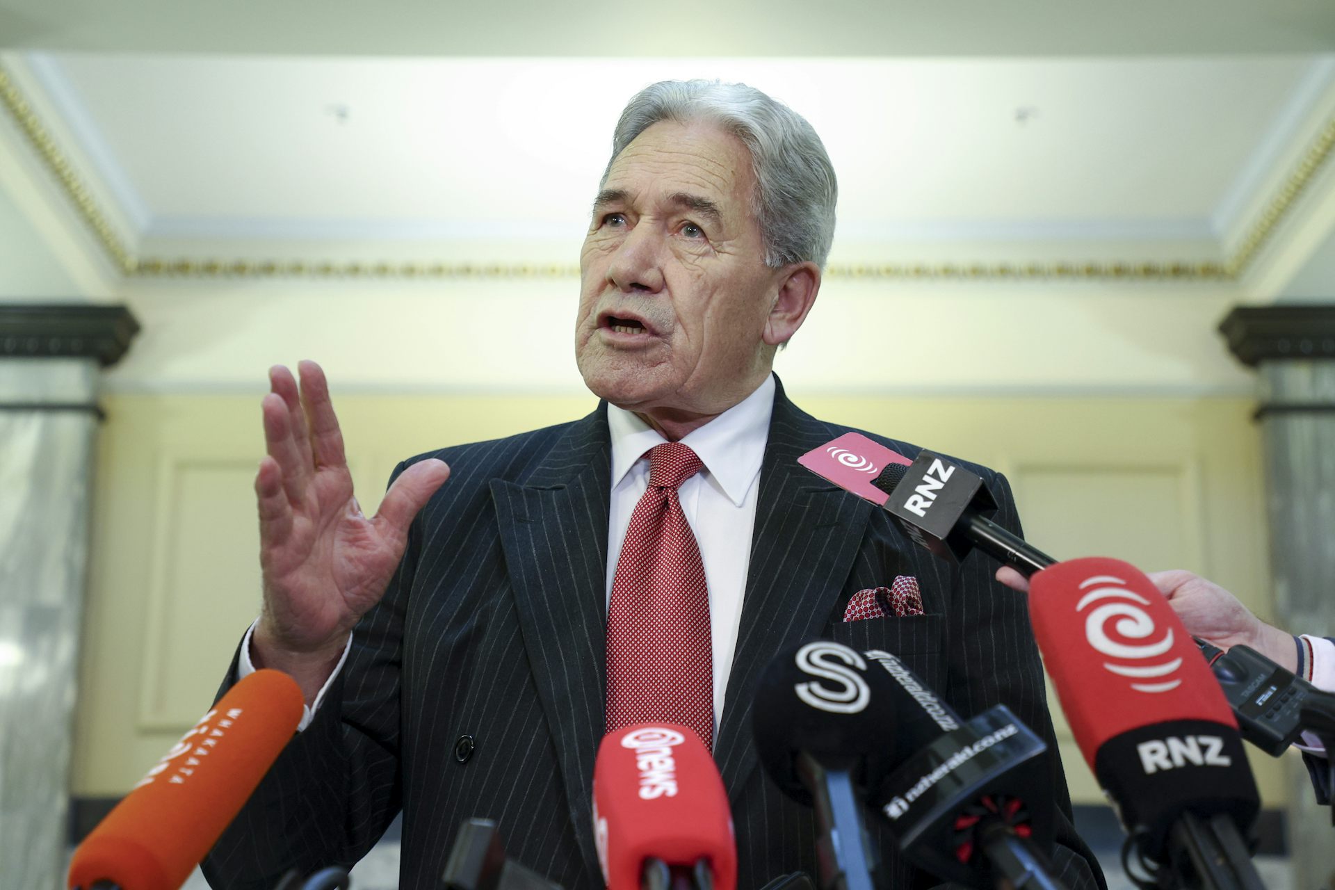Winston Peters gesturing while talking to media