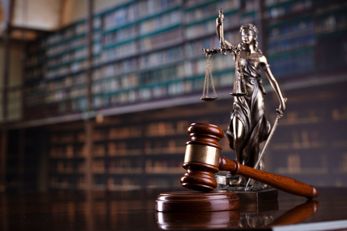 Judge's gavel and statuette of a blindfolded 'Lady Justice'