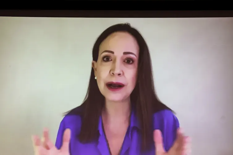 Maria Corina Machado speaks to a conference remotely.