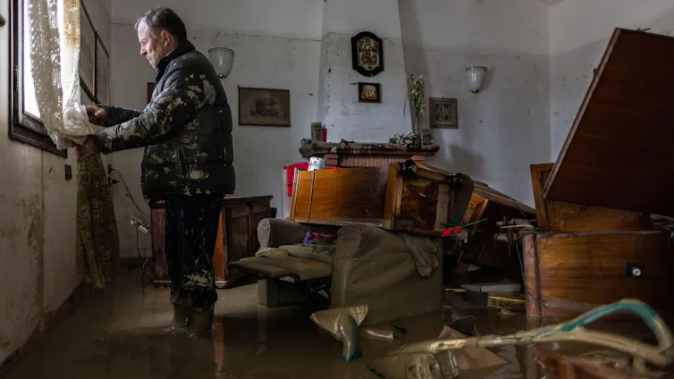Photo of man in a flooded room