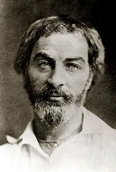 Black-and-white photographic portrait of bearded man.