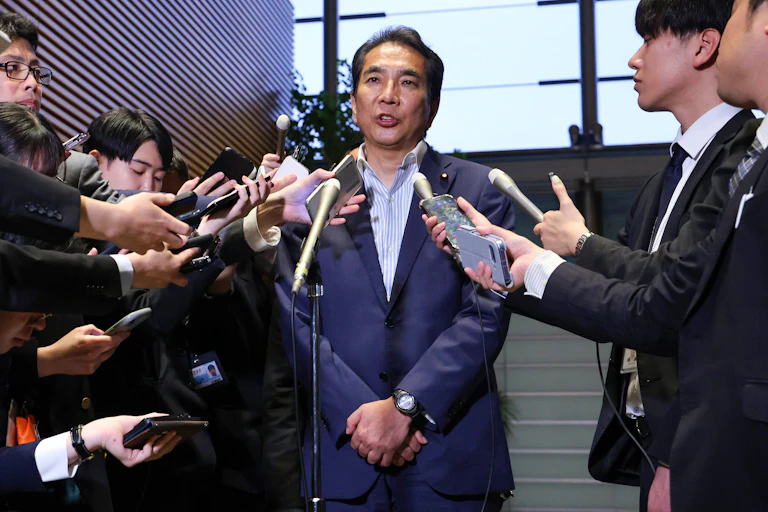 Taku Etō speaks to reporters in Tokyo.