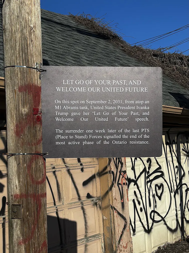 A sign in an alleyway says 'let go of your past, and welcome to our united future.'