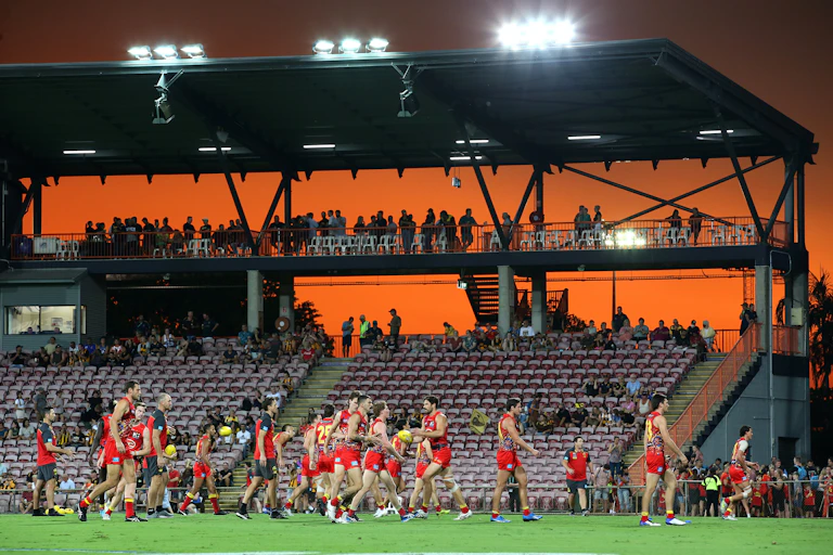 Gold Coast players walk off after an AFL game at Darwin's TIO Stadium.