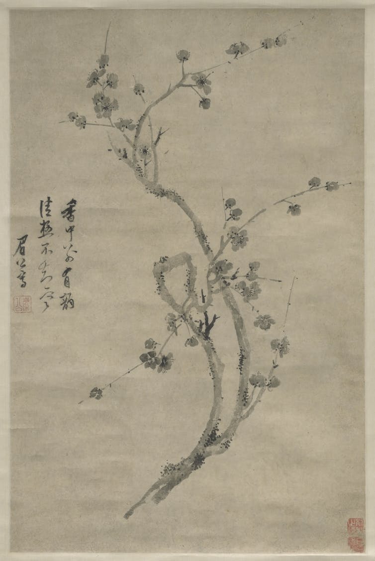 A close up black and white ink drawing of a plum blossom branch on a scroll. Three lines of calligraphy on the right side.
