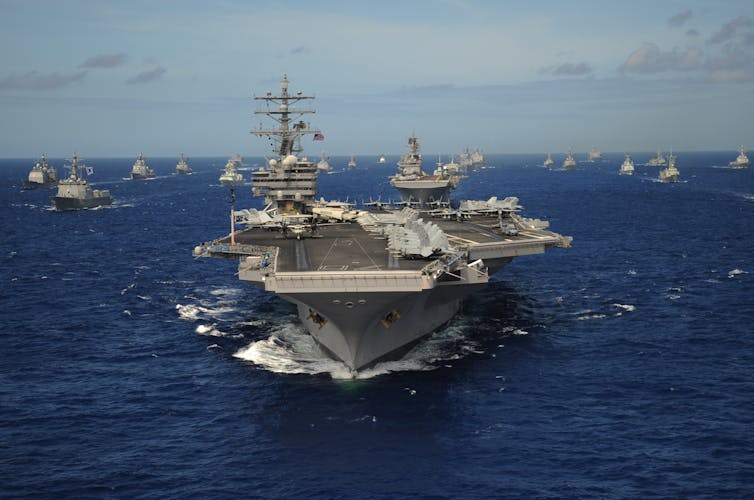 A convoy of naval ships in the Pacific Ocean.