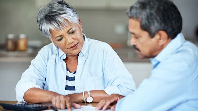 Cropped shot of a senior couple doing their household finances while sitting at home