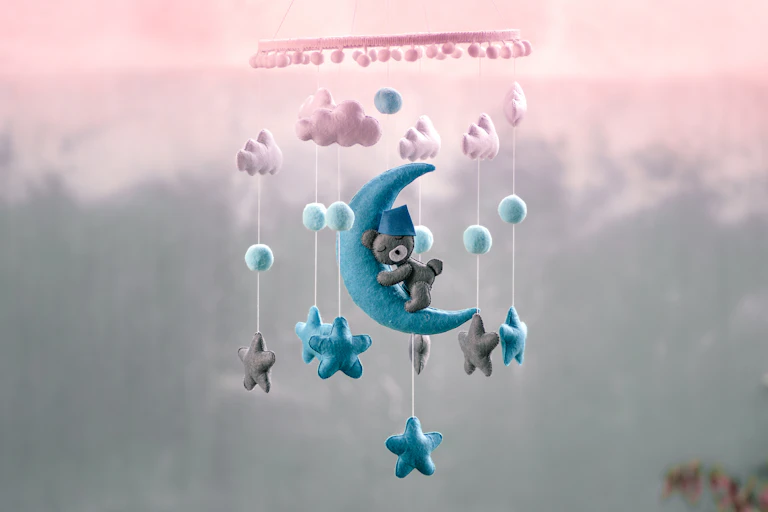 Picture of a baby's mobile hanging above a cot