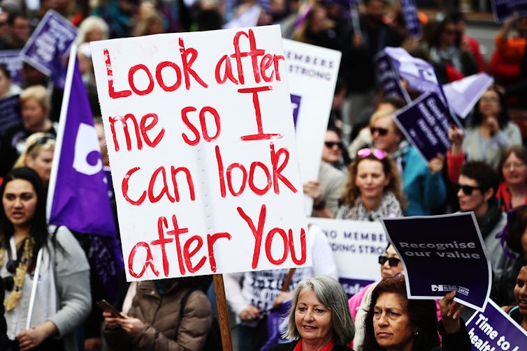 Nurses strike with posters.