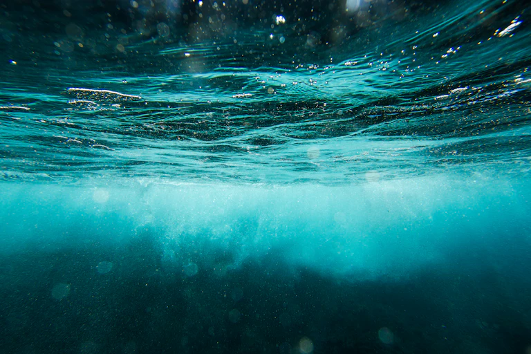 A view of the ocean underwater with currents close to the surface