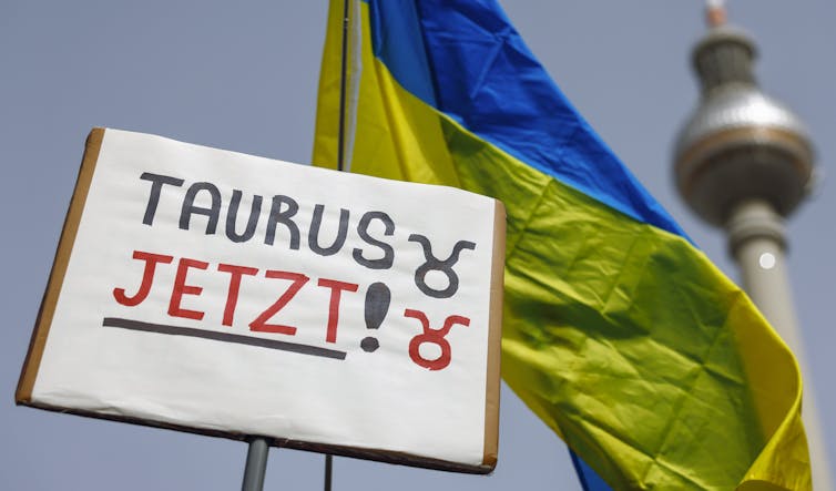 Kyiv’s allies have lifted restrictions on Ukraine attacking objectives inside of Russia – right here’s what that suggests for the struggle 1 A places reasing Taurus now in German in front of a Ukrainian naitonal flag.