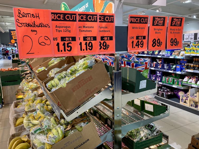 fresh fruit and veg in a supermarket with price signage