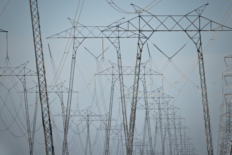A group of large metal structures holding electric wires.