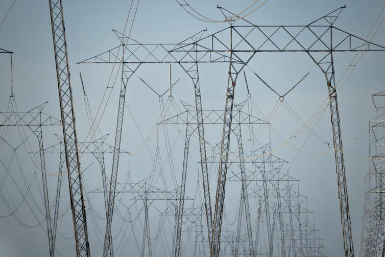 A group of large metal structures holding electric wires.