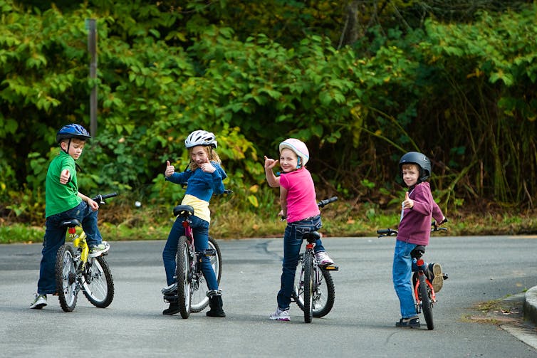 Kids want the liberty to play on driveways and streets once more – right here’s the right way to make it occur 1 Children on bikes smiling back at camera