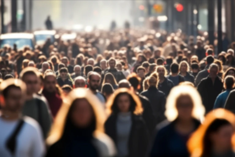 Large crowd of pedestrians in a city centre.