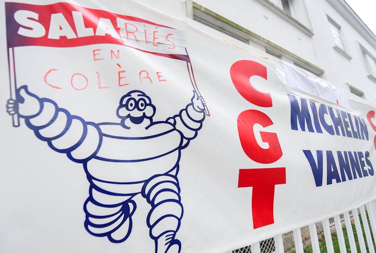 Must we shut the factories that shut? In Brittany, Michelin's injuries and a inexperienced hydrogen 1 Closing on a banner with Michelin Bibendum and CGT logo