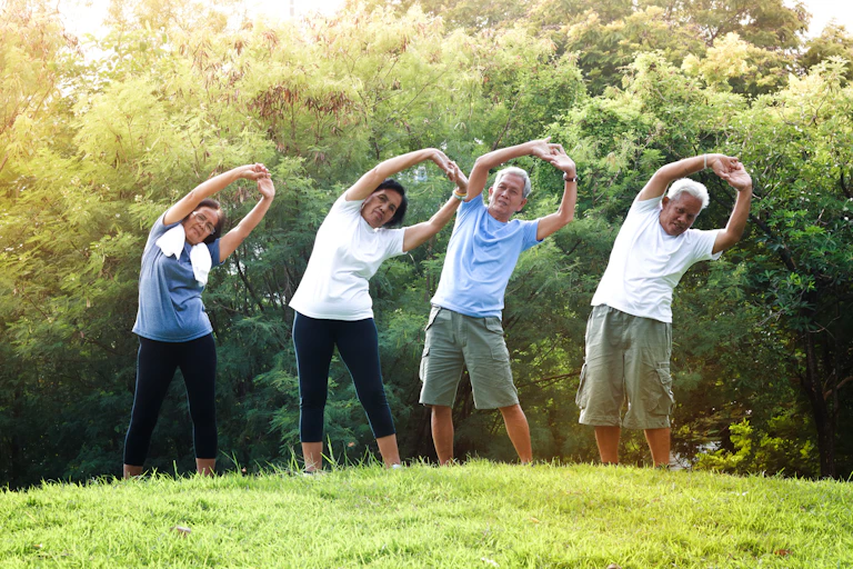A group of people stretching outdoors.s
