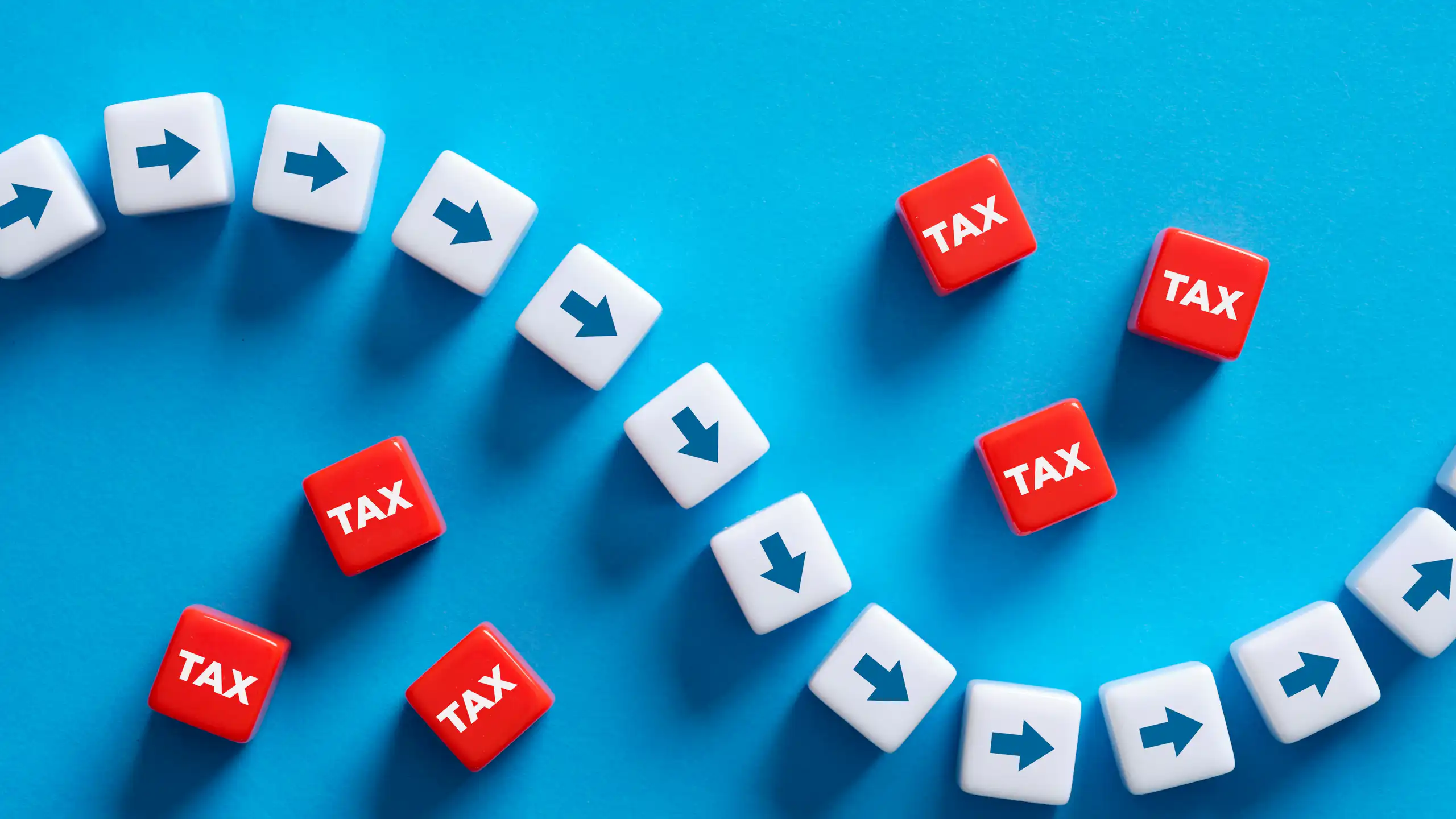 Illustration of arrows plotting path through blocks mark tax to show tax avoidance.