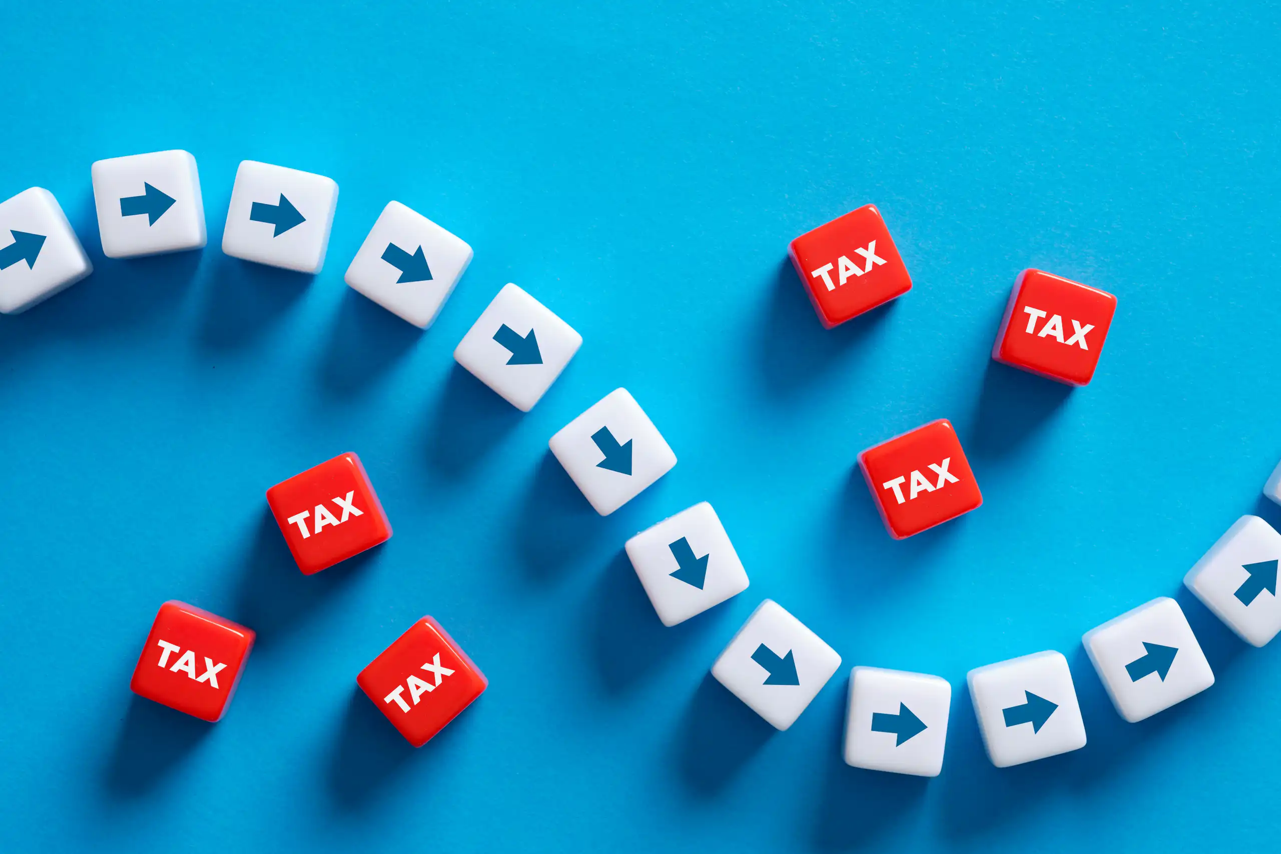 Illustration of arrows plotting path through blocks mark tax to show tax avoidance.