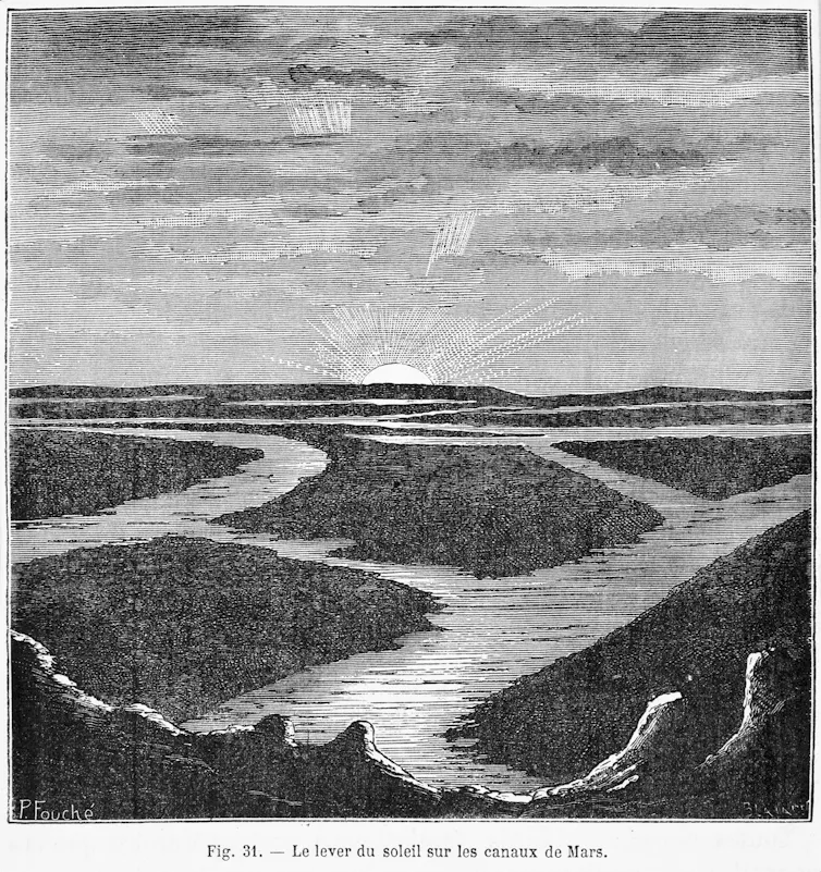 A vintage photo of rocky terrain intersected by canals.