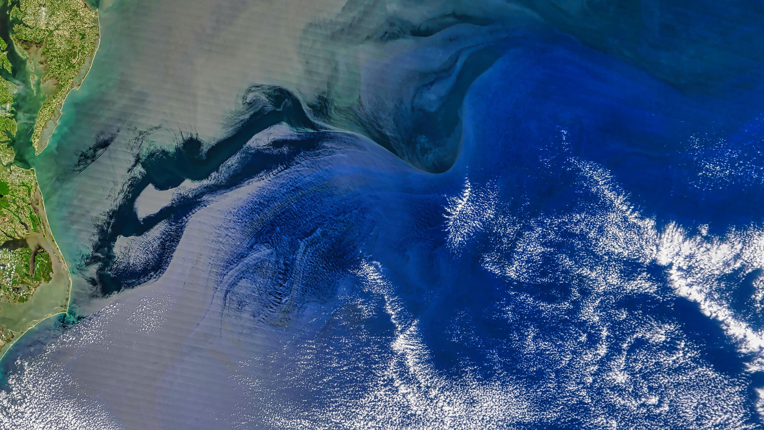 A satellite image of a coastline.
