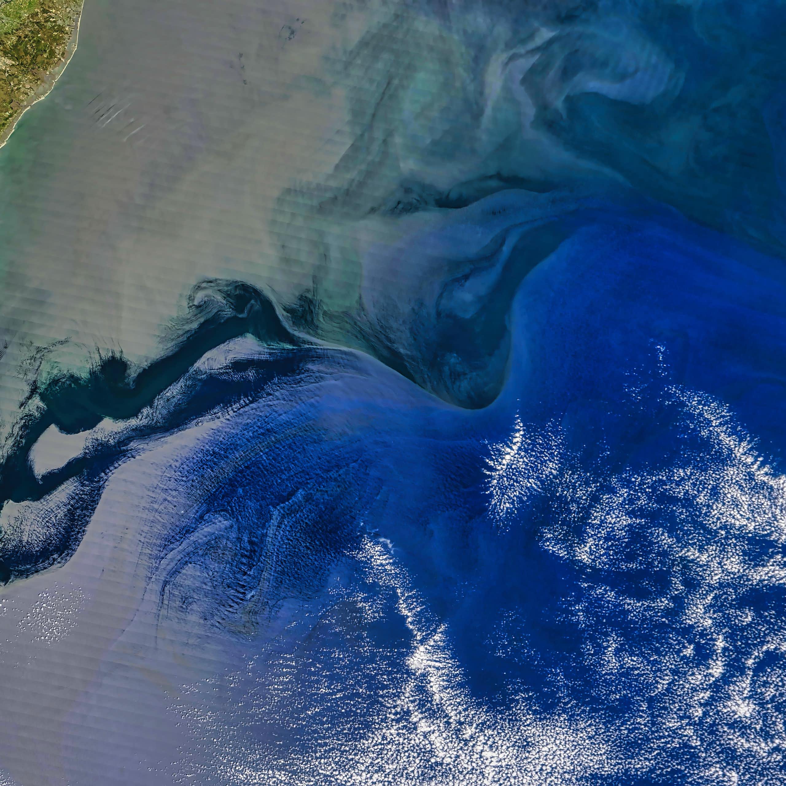 A satellite image of a coastline.