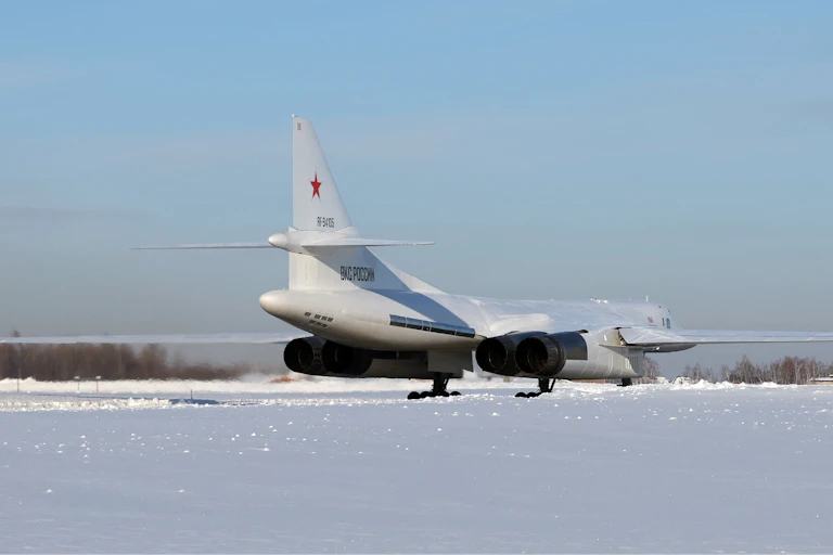 A large aircraft is on an icy runway.