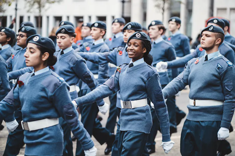 Group of cadets in blue marching