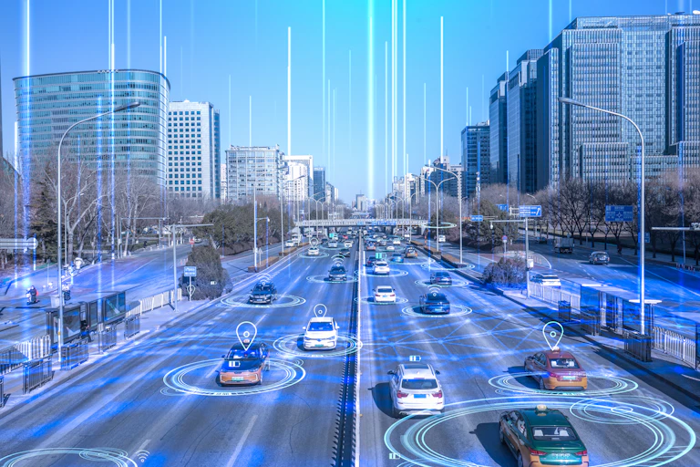 Six-lane highway going through a city with cars – each car is diagrammed with sensor circles, connection lines and lines leading up to the sky