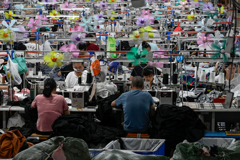 workers producing garments at a textile factory that supplies clothes to fast fashion e-commerce company Shein in Guangzhou