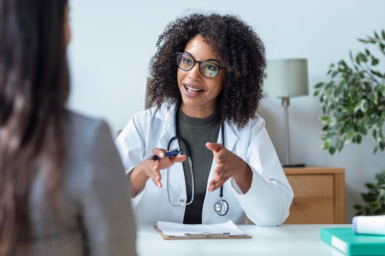 a female doctor speaking with a patient