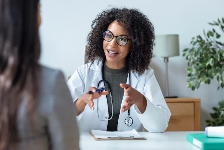 a female doctor speaking with a patient