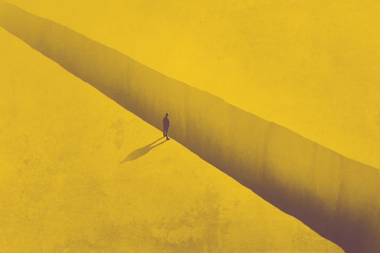 Illustration of a human figure standing alone on the edge of a cliff.
