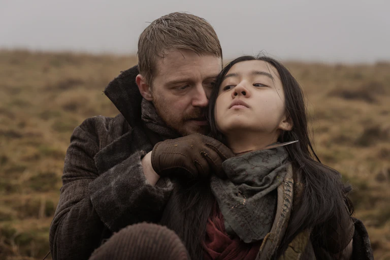 Jack Lowden holding a knife to Kôki's beck